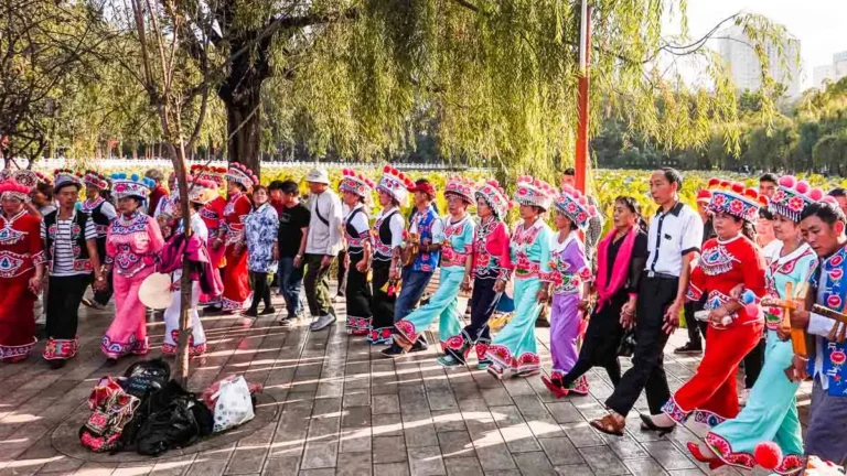 Locals-in-traditional-ethnic-costumes-dancing-at-Cuihu-green-lake-park-Things-to-do-in-Kunming-city