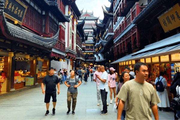 Visitors walking through a classical Chinese garden with red heritage buildings
