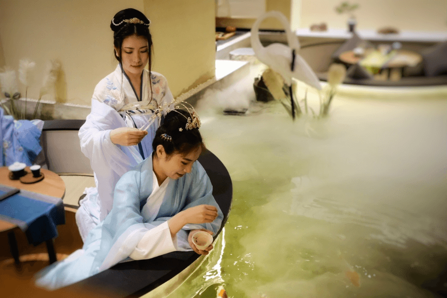 Two students enjoying a traditional Chinese tea ceremony
