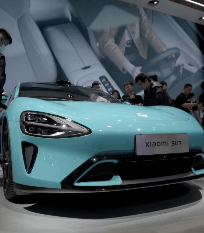 Light blue Xiaomi SU7 electric car displayed at China Auto Show